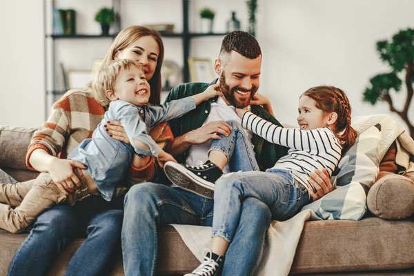 Happy family on a couch.