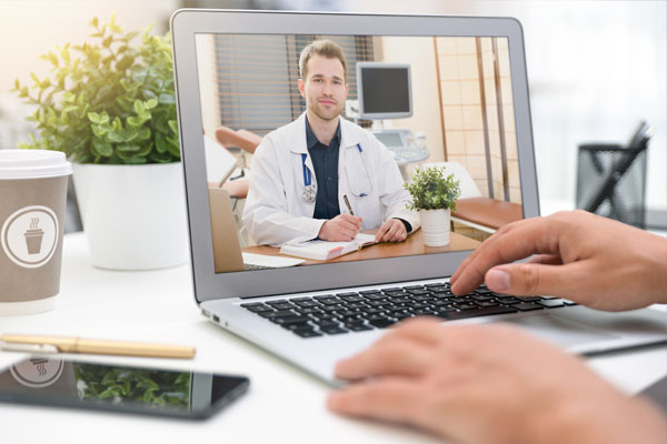 Telemedicine consultation on a laptop.